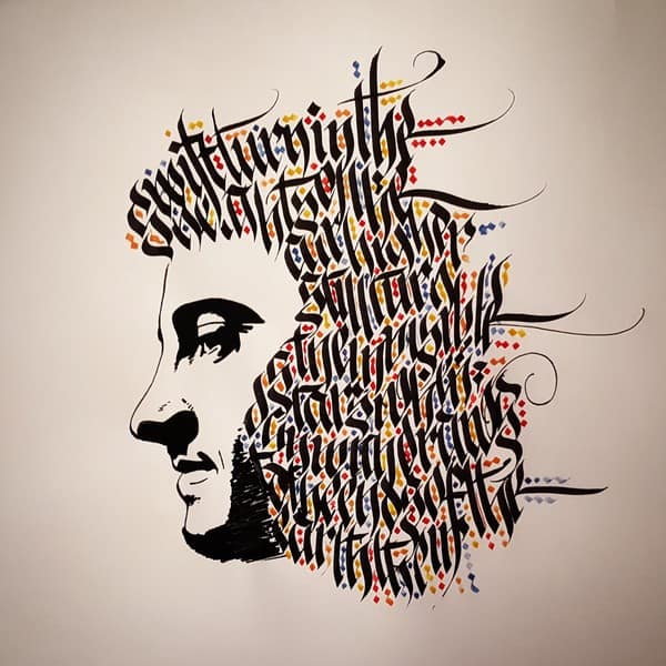 Portrait de Juliooz avec illustration à l'encre de chine et calligraphie gothique - par Juliooz - JA Design - Graphiste
